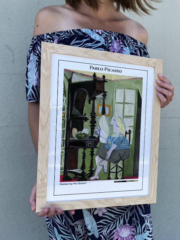 Pablo Picasso Woman by the dresser Poster