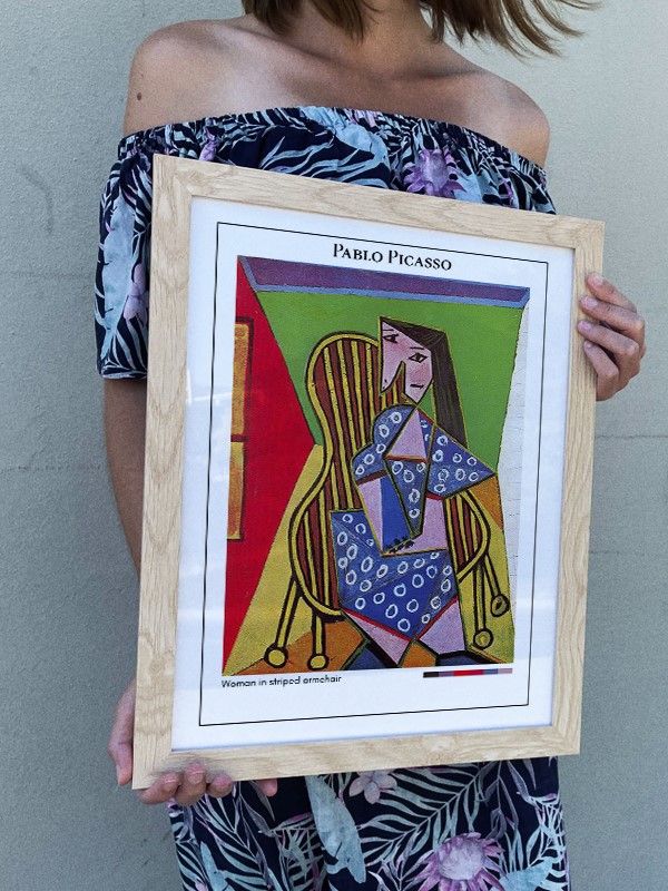 Pablo Picasso Woman in striped armchair Poster