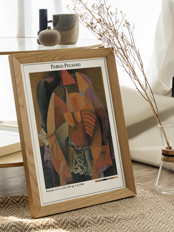 Pablo Picasso Woman with a shirt sitting in a chair Poster