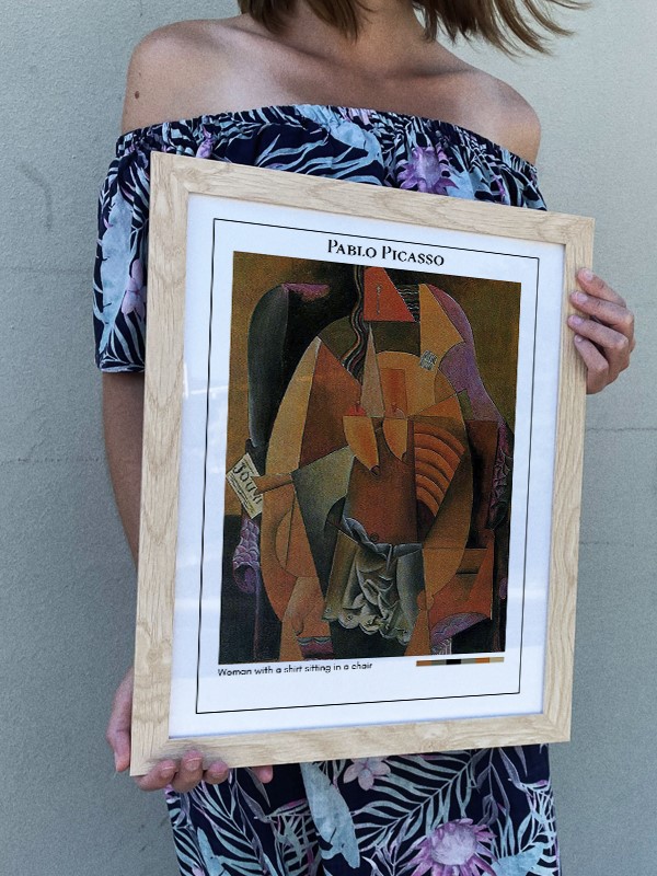 Pablo Picasso Woman with a shirt sitting in a chair Poster